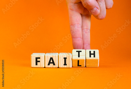 Faith instead fail symbol. Businessman turns wooden cubes and changes the concept word Fail to Faith. Beautiful orange table orange background. Business and faith instead fail concept. Copy space.