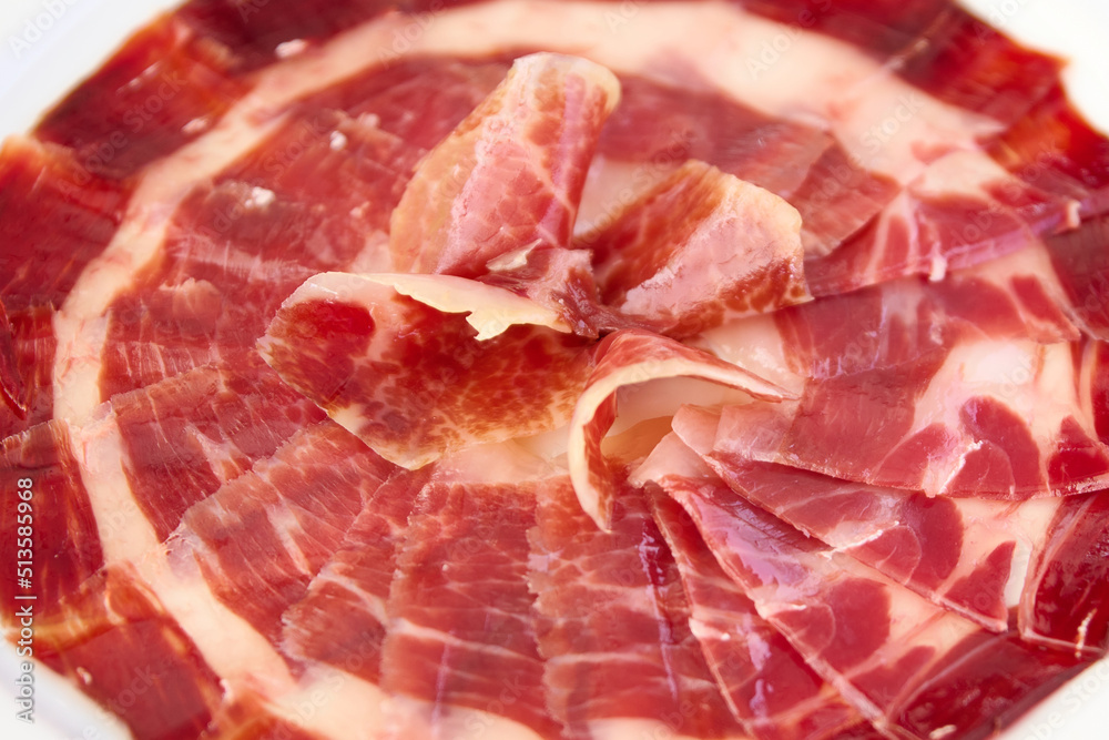 plate with sliced Iberian ham