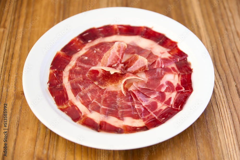 plate with sliced Iberian ham