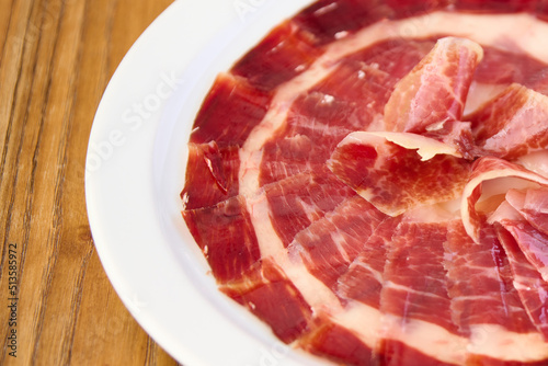 plate with sliced Iberian ham