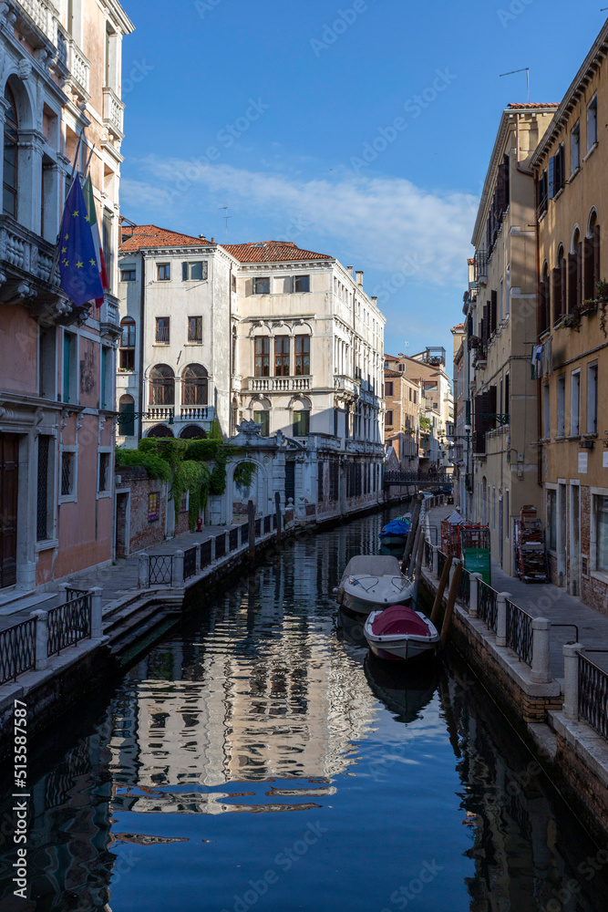 Narrow canal in Venice on a summer morning