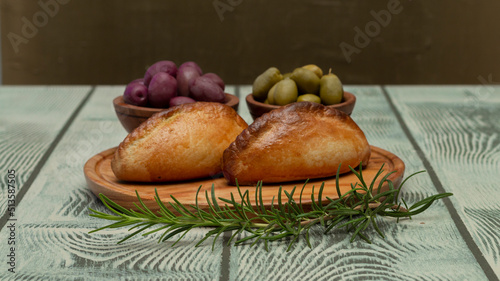 La salteña es un tipo de empanada de origen boliviano , ​ comido como una merienda jugosa y rellena con carne, pollo u otras carnes, huevo duro, especias, y otros ingredientes, cocida al horno