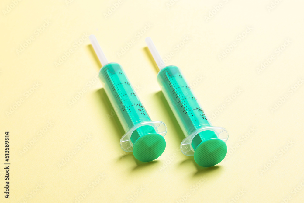 Top view of medical syringes on colorful background. Health care concept with copy space Top view of medical syringes on colorful background. Health care concept with copy space