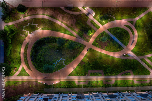 Night paved path road in the courtyard at night top aerial view