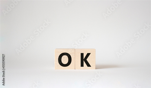 Ok symbol. Concept word Ok on wooden cubes. Beautiful white background. Business and Ok concept. Copy space.