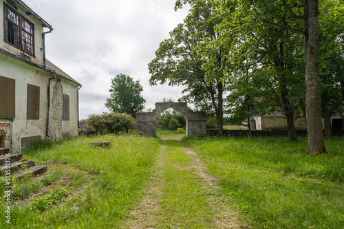 old stone fence with arch