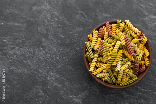 colorful fusilli pasta. Multicolor spiral macaroni. Closeup.