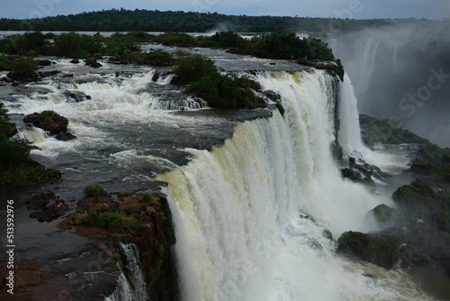 The photo shows a stunning view from the top of the Iguazu Falls — a complex of 275 waterfalls on the Iguazu River, located on the border of Brazil and Argentina.