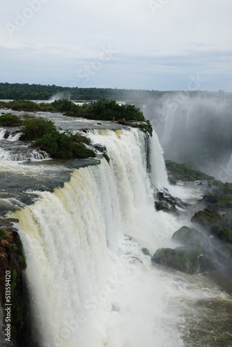 The photo shows a stunning view from the top of the Iguazu Falls — a complex of 275 waterfalls on the Iguazu River, located on the border of Brazil and Argentina.