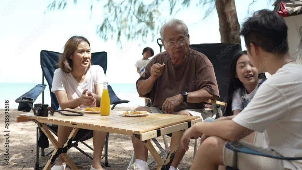 Happy family of grandfather senior taking together, Cooking food outside beach, enjoy summer on the beach enjoy on weekend people lifestyle. Happy family of grandfather senior taking together, Cooking food outside beach, enjoy summer on the beach enjoy on weekend people lifestyle.