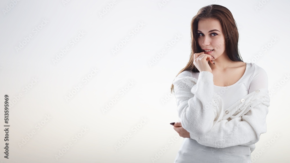 Young woman, standing in clothing, smiling and looking confident. Young woman, standing in clothing, smiling and looking confident.