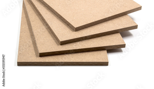 Four boards of raw MDF, a material made from chopped wood.
