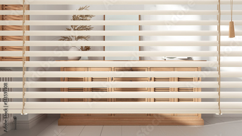 White venetian blinds close up view  over modern kitchen  classic living room with wooden and rattan chest of drawers and decors  interior design  privacy concept
