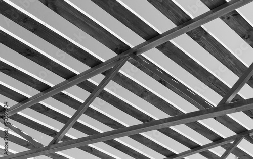 Steel framework with wooden boards, black and white photo