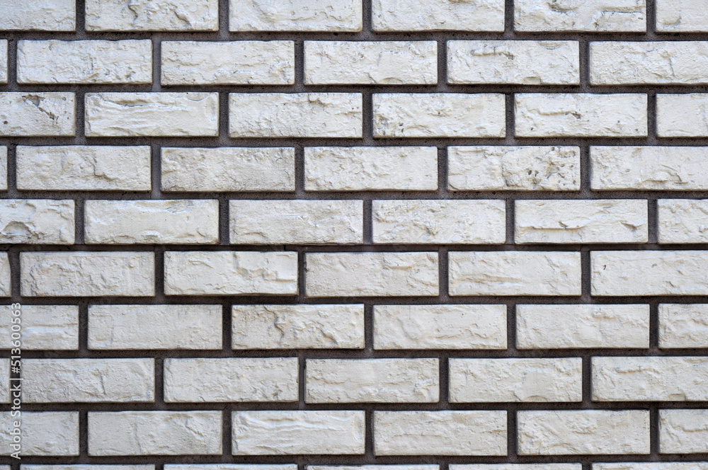 Texture brick white and dark gray seams, stone masonry light. Facade tile Texture brick white and dark gray seams, stone masonry light. Facade tile