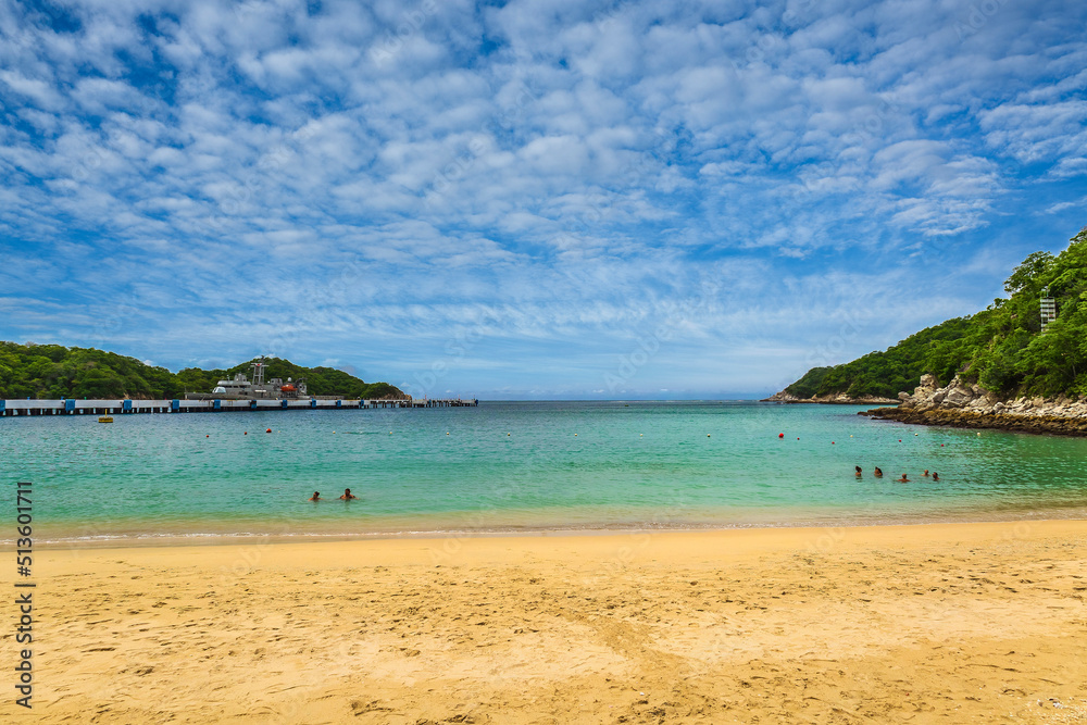 Fototapeta premium Beautiful Huatulco bay, Oaxaca - Mexico. Santa Cruz marina and resort hotels. Bahias de Huatulco was developed in the 1980s by FONATUR, Mexico's tourism development age