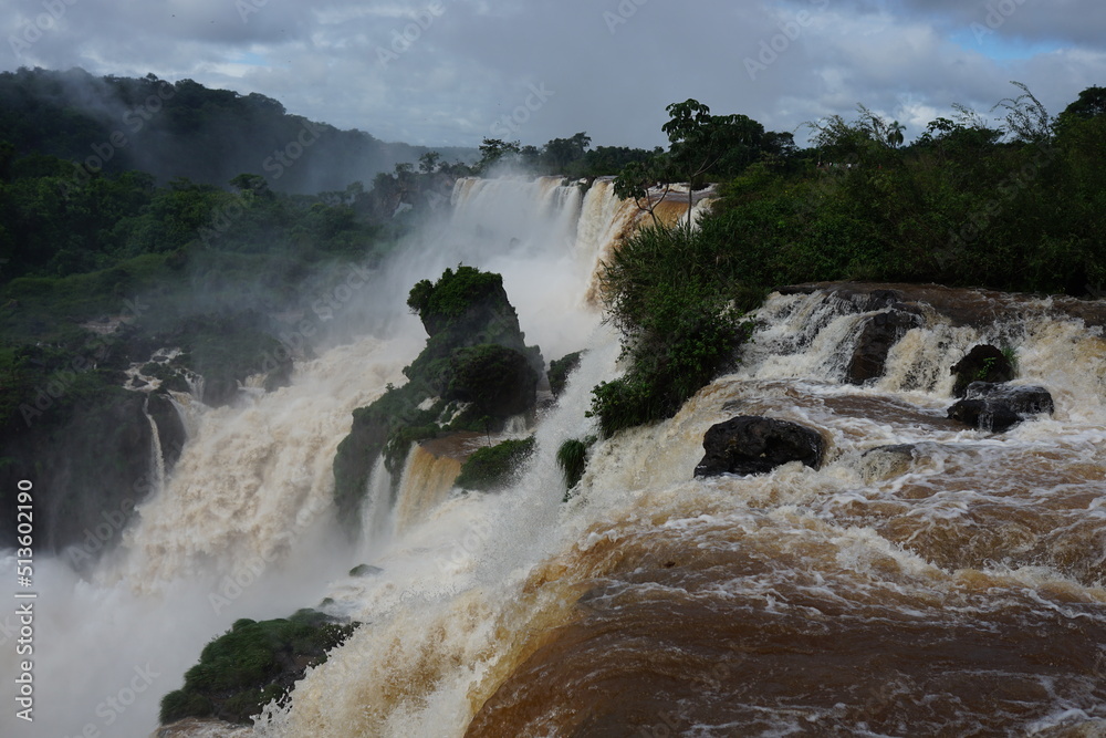 The photo shows a stunning view from the top of the Iguazu Falls — a ...