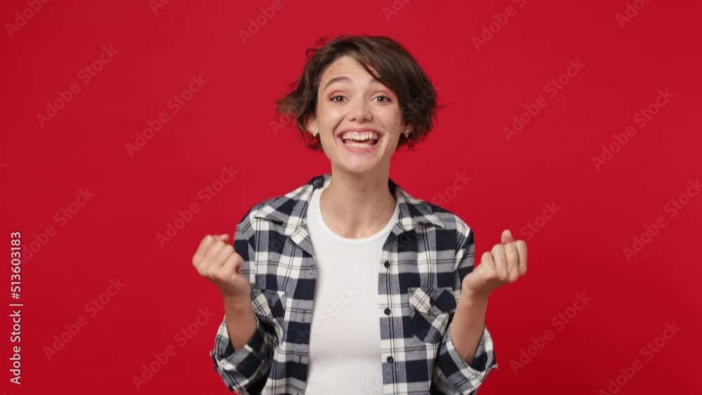 Smiling good kind surprised happy young woman 20s she wears casual clothes ask who me oh it so sweet put hands on chest isolated against over plain solid dark red color wall background studio portrait Smiling good kind surprised happy young woman 20s she wears casual clothes ask who me oh it so sweet put hands on chest isolated against over plain solid dark red color wall background studio portrait