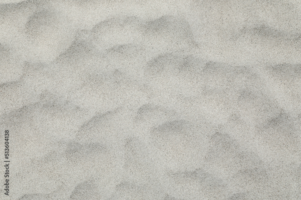 Naklejka premium Sand on the beach as background texture