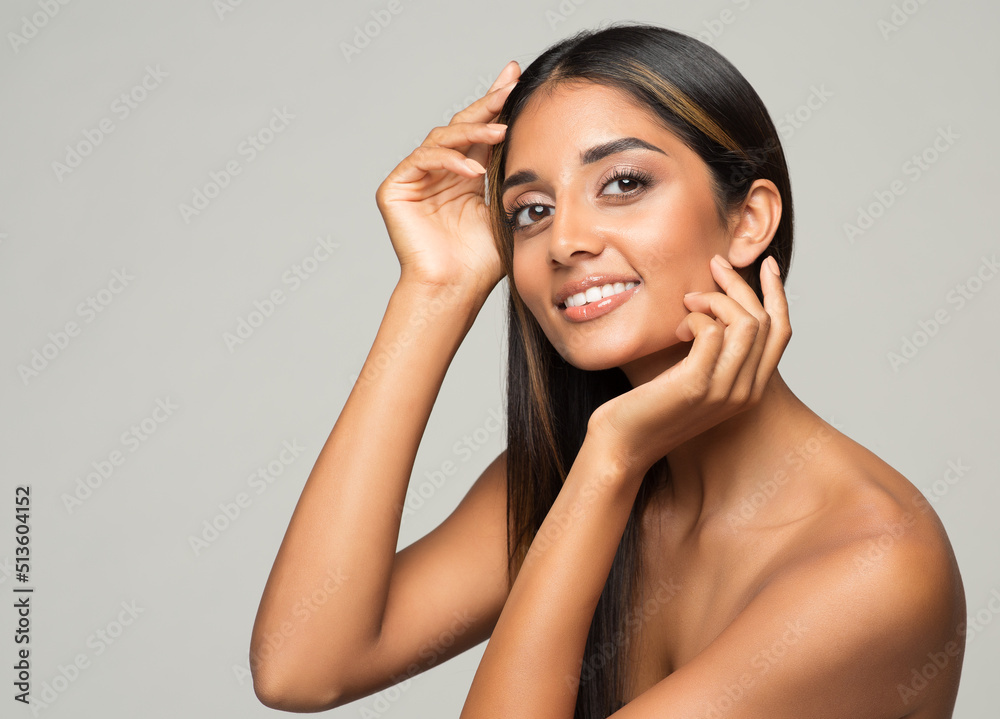Beauty Woman Face Skin Care. Happy Smiling Indian Girl Portrait over Gray. Diversity Beautiful Women. Body Care and Facial Lifting Treatment Cosmetics Beauty Woman Face Skin Care. Happy Smiling Indian Girl Portrait over Gray. Diversity Beautiful Women. Body Care and Facial Lifting Treatment Cosmetics