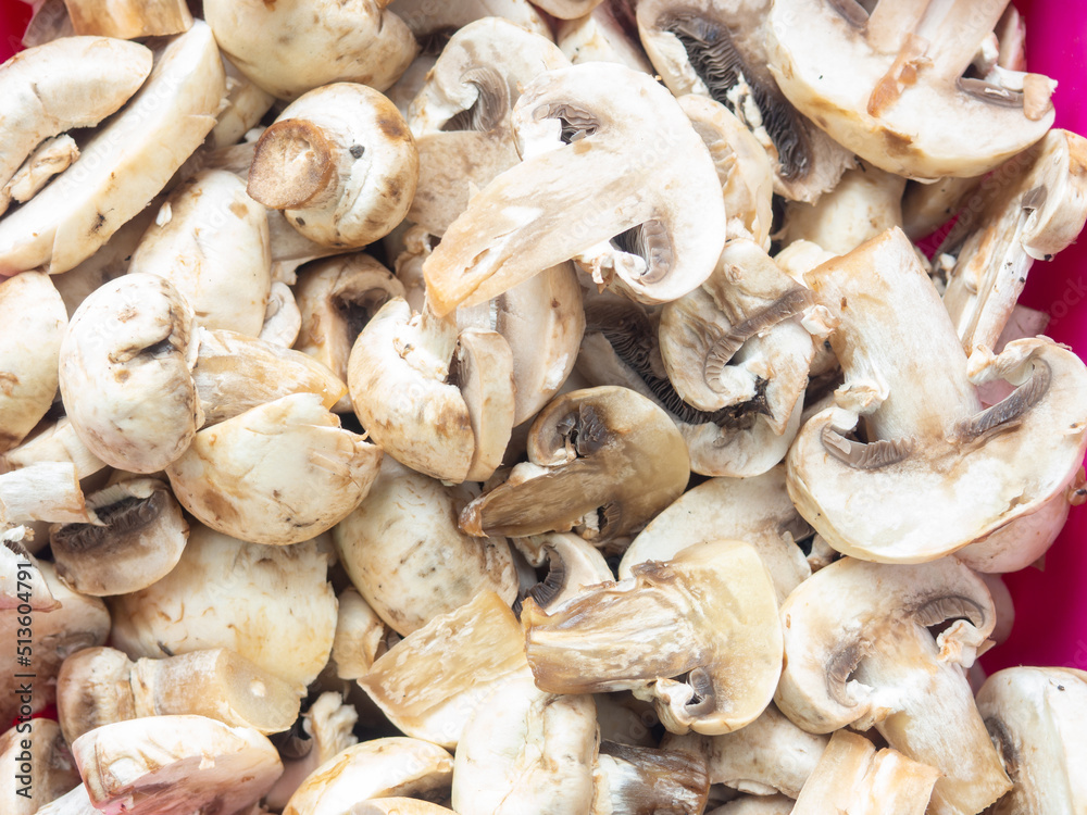 Lots of chopped mushrooms. Cooking dishes with mushrooms. Raw chopped mushrooms. Unprepared product. Lots of chopped mushrooms. Cooking dishes with mushrooms. Raw chopped mushrooms. Unprepared product.