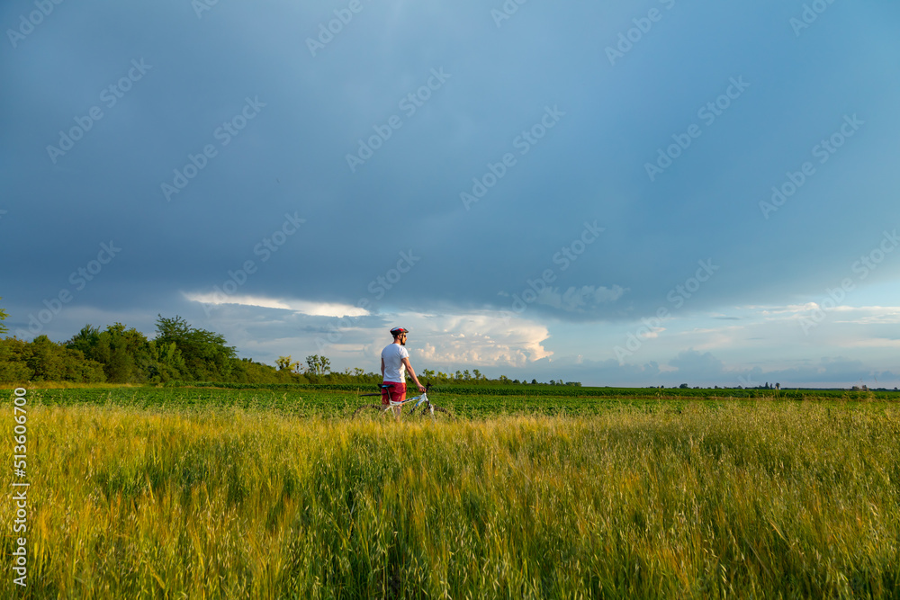 cyclist riding a bike in the countryside, active lifestyle. The concept of extreme cycling, free space. cyclist riding a bike in the countryside, active lifestyle. The concept of extreme cycling, free space.