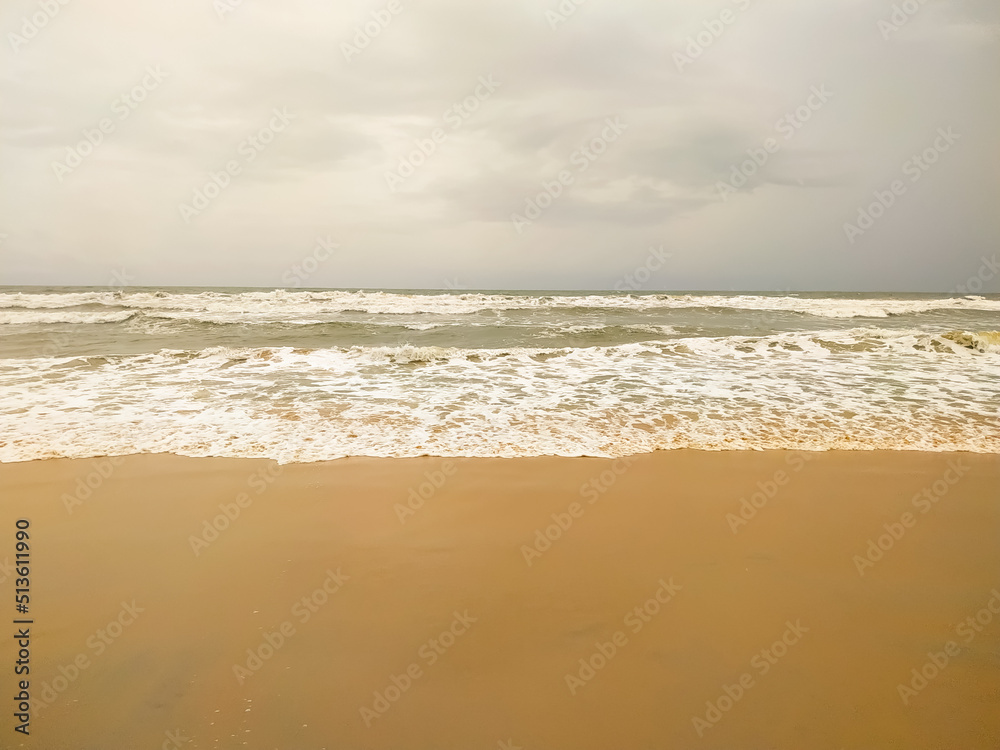 Beautiful wave on the sand beach background
