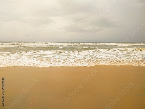 Beautiful wave on the sand beach background
