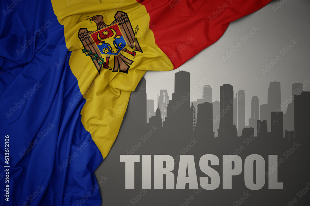 Obraz na płótnie abstract silhouette of the city with text tiraspol near waving national flag of moldova on a gray background. w salonie