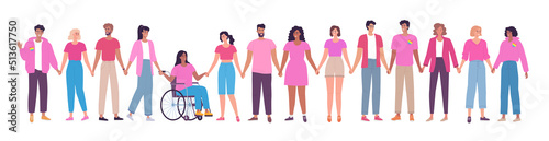 Different people dressed in pink stand together and hold hands. People stand up for women's rights