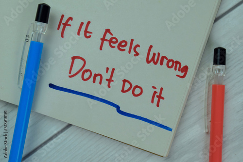 Canvastavla Concept of If It Feels Wrong Don't Do it write on a book isolated on Wooden Table