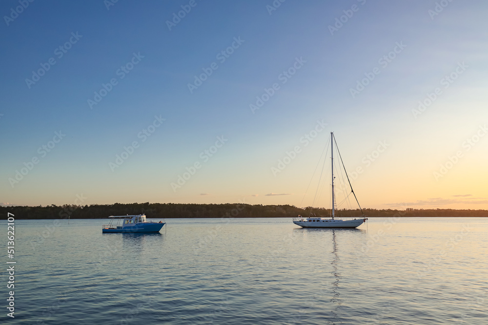 Boats on the Clarence RIver at sunset. Iluka NSW Australia Boats on the Clarence RIver at sunset. Iluka NSW Australia