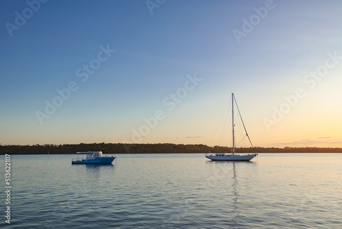 Boats on the Clarence RIver at sunset. Iluka NSW Australia