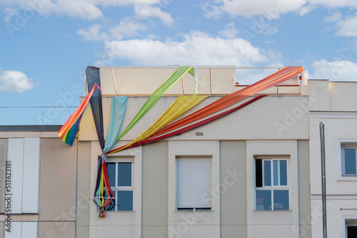 Photography facade with colored fabrics symbolizing the pride flag