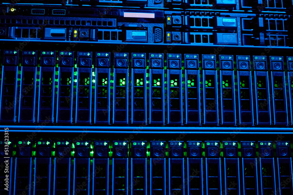 Graphic background image of blade servers in blue neon light stacked in data center, copy space Graphic background image of blade servers in blue neon light stacked in data center, copy space
