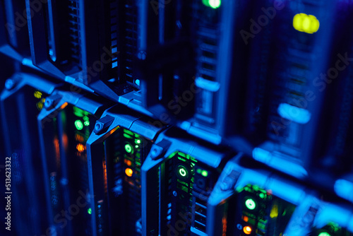 фотографія Macro image of blade servers in blue neon light stacked in data center, copy spa