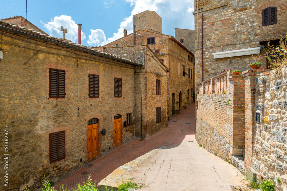 Narrow streets and alleys inside the walls of the medieval hill town of San Gimignano, Italy, in the Tuscany region.