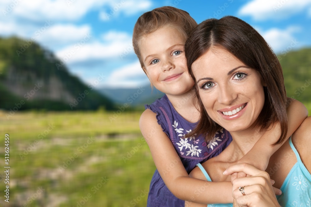 Happy mother having fun with her daughter outdoor Happy mother having fun with her daughter outdoor