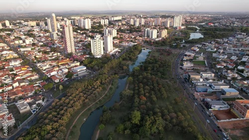 Indaiatuba Ecological Park. Beautiful park in the city center, with lake and beautiful trees and houses. Aerial view.