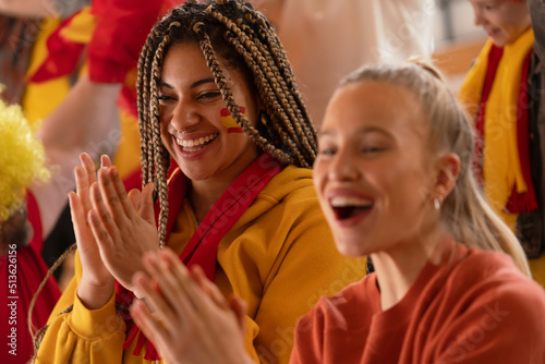 Spanish football fans celebrating their team's victory at stadium.