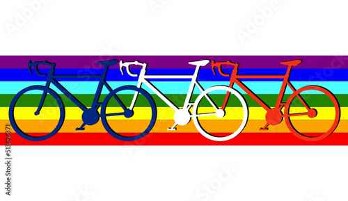 three bicycles form the French tricolor, the French flag in honor of France; behind the rainbow dedicated to those who believe in the environment, solidarity, peace, equality, freedom and fraternity. photo