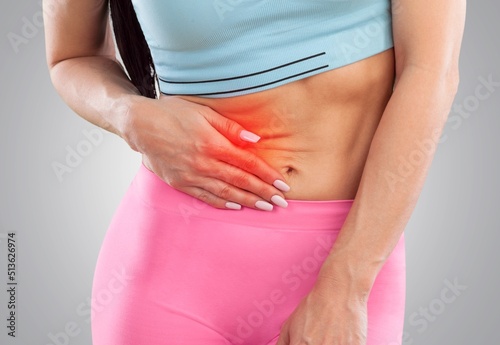 Woman with stomach pain causes of abdominal pain include inflammatory bowel disease. stomach ulcer irritable bowel syndrome, ulcerative colitis and microvilli.