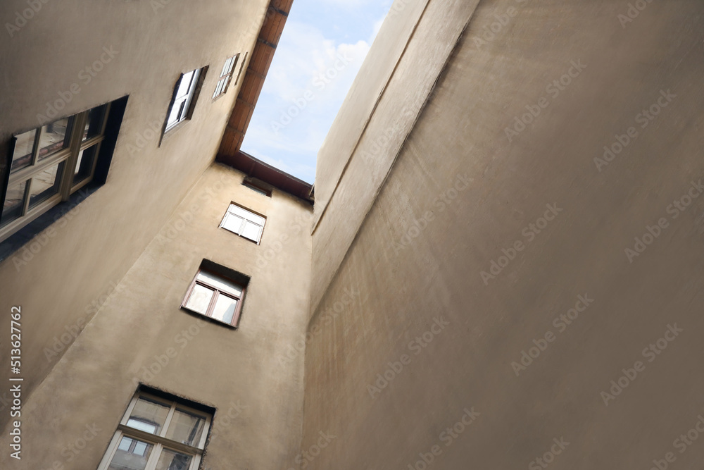Obraz premium Beautiful old building against blue sky, low angle view