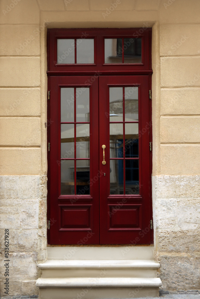View of building with wooden door. Exterior design View of building with wooden door. Exterior design