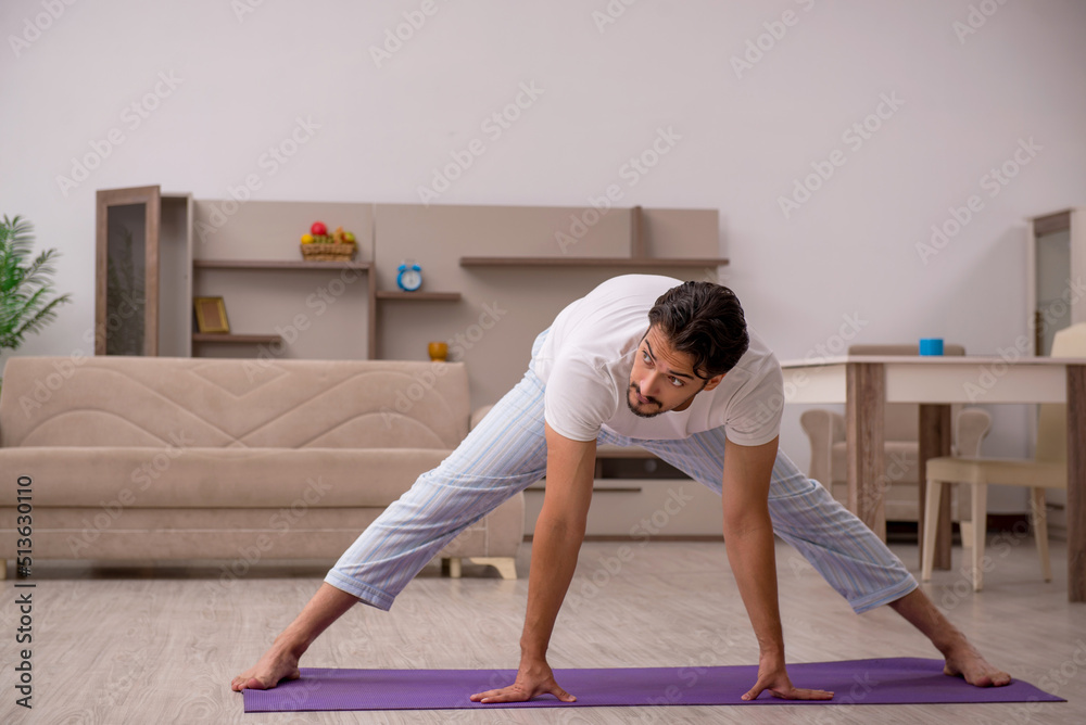 Young man doing sport exercises at home Young man doing sport exercises at home