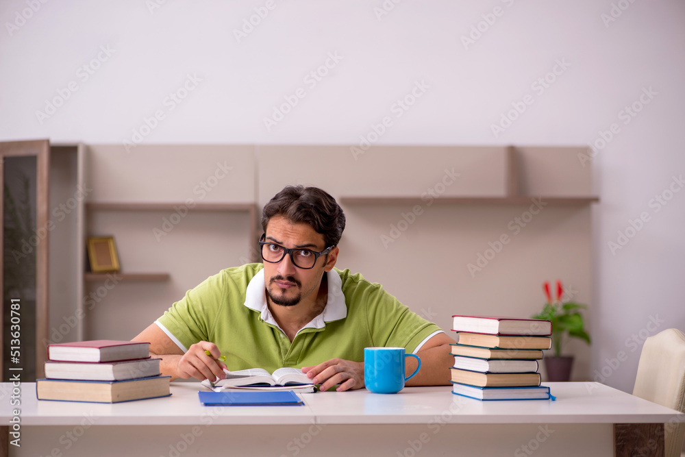 Young male student studying at home Young male student studying at home