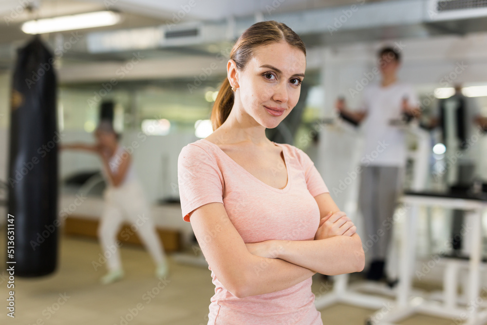 Portrait of young slender woman in the gym for self defense exercises