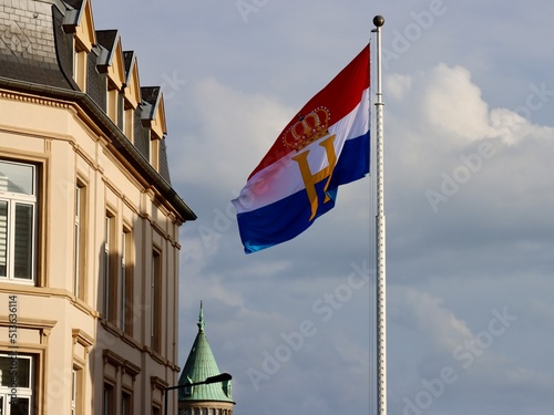 Luxembourg flag with monogram H and crown, flown to celebrate National day and Grand Duke's Henry official birthday on June 23rd