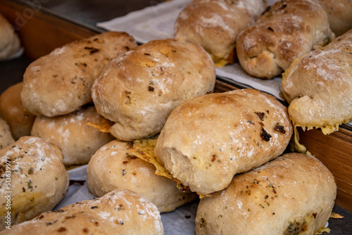 Rich homemade bread with fried onions inside. Flour-based food. © Horacio Selva