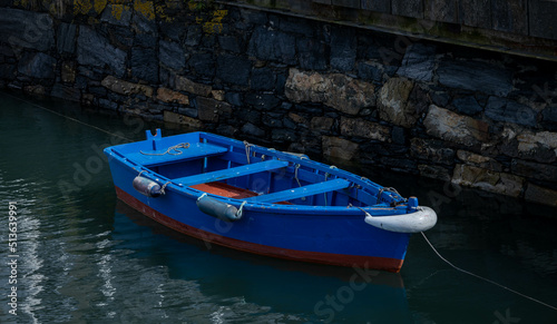 Fototapeta Naklejka Na Ścianę i Meble -  Small wooden boat moored at the pier.